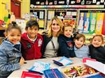 Kids gathered around their teacher